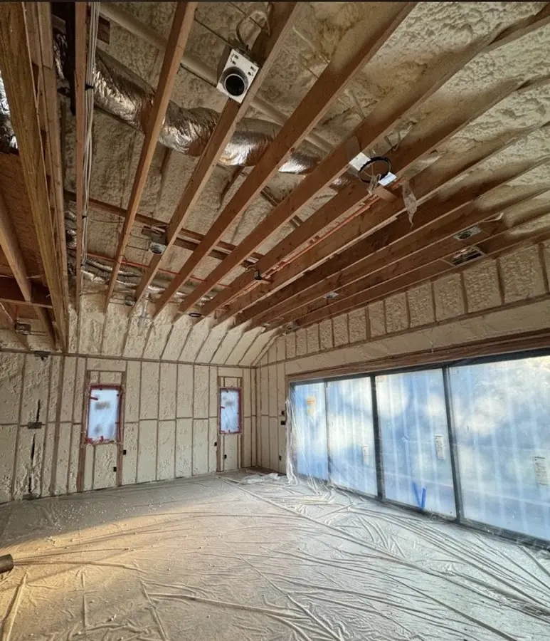 Interior walls and ceiling insulated with spray foam during new construction in Claremont